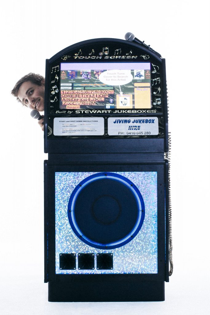 glenn poking behind the jukebox